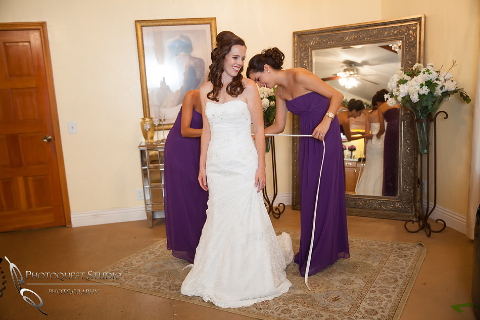 bride and bridesmaid getting ready, Falkner winery wine wedding by temecula wedding photographer