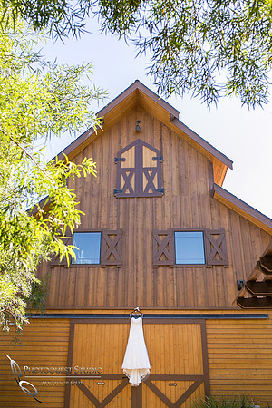 Wedding dress on the barn at Longshadow Ranch Winery by Temecula Wedding Photographer