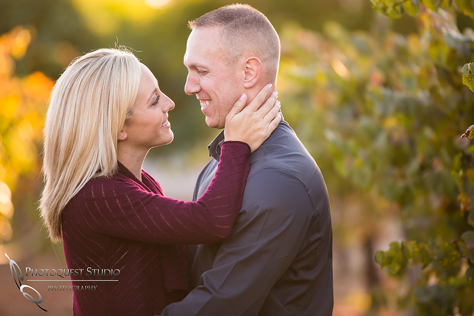 cheerful moment at the vineyard at Engagement photo at South Coast Winery, California by Temecula Wedding Photographers