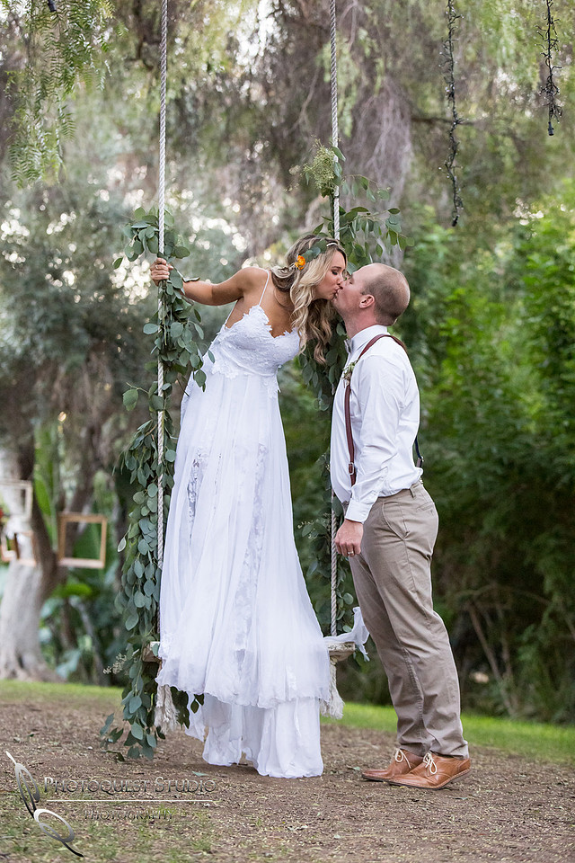 Kissing on the swing at Green Gables Estate, San Diego Premier Wedding by Temecula Wedding Photographer