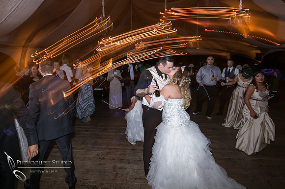 Kissing on the dance floor by Fallbrook, Temecula Wedding Photographer