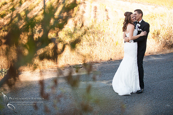 the first kiss at the first look by Falkner winery wine wedding by temecula wedding photographer