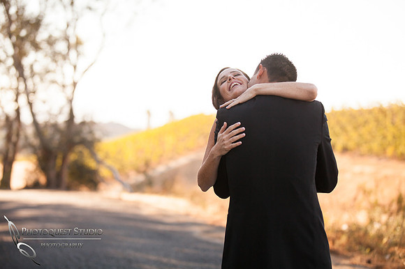 the fist hug after the first look at Falkner winery wine wedding by temecula wedding photographer