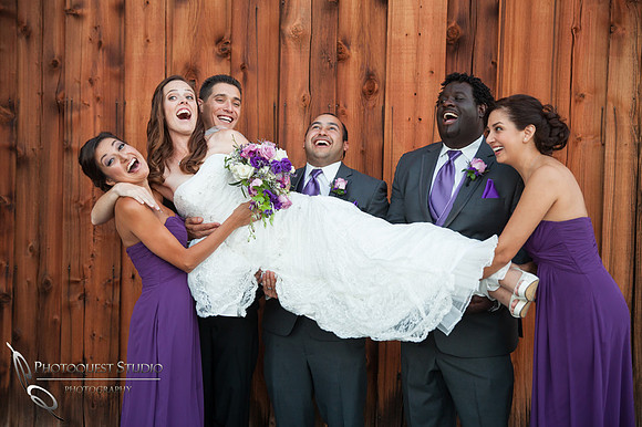 groom and bridal party holding the beautiful bride at Falkner winery wine wedding by temecula wedding photographer