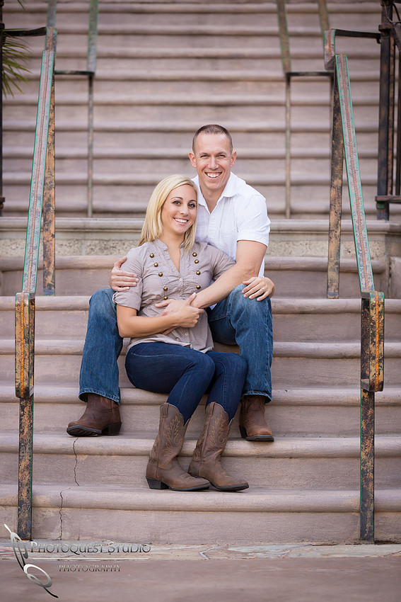 Couple sitting by the stairway at Engagement photo at South Coast Winery, California by Temecula Wedding Photographers